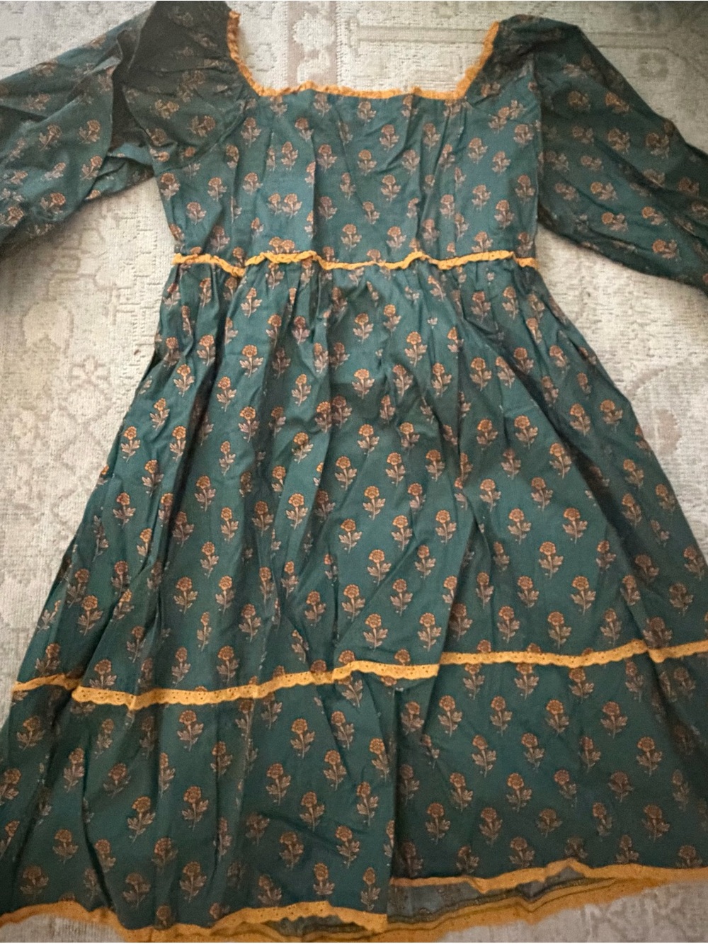 Shop the Mint Women’s Green Floral Tiered Dress with Mustard Trim